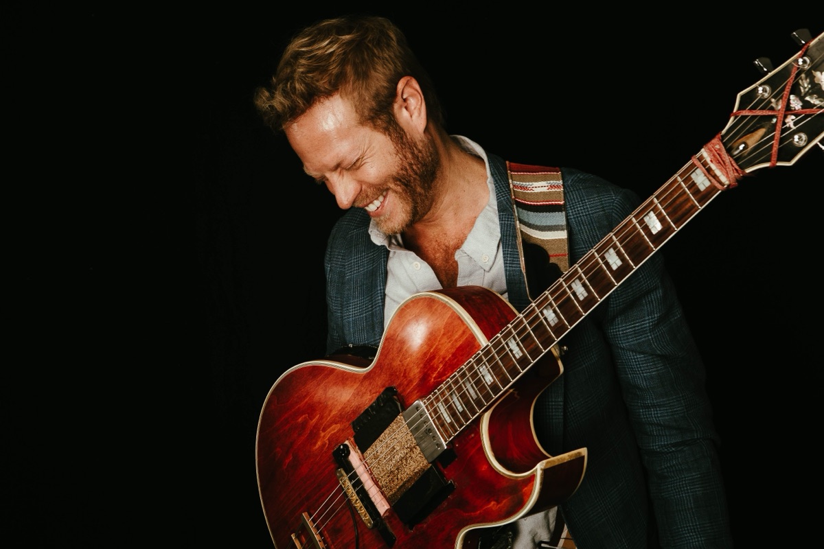 Rotem Sivan smiling while playing his archtop jazz guitar